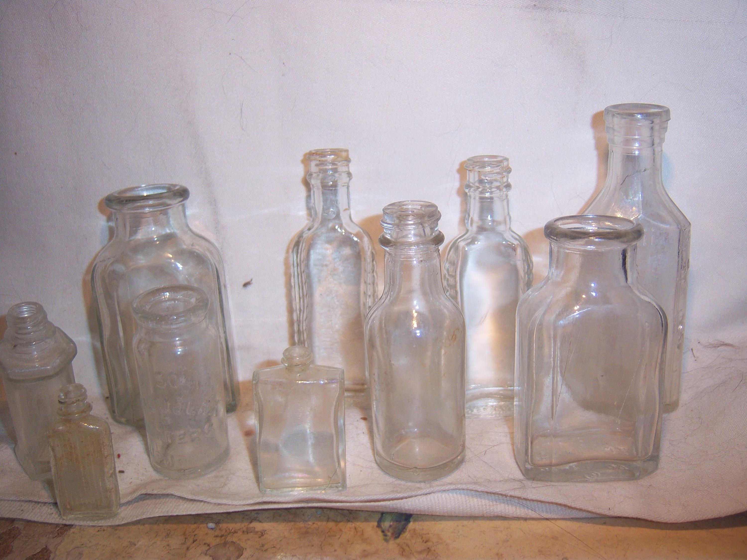 1930-1960's Lot Of 10 Clear Medicine Food Bottles 1 3/4 To 4 5/8 Inches Tall