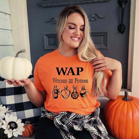 Popular Heather Orange Wap Witches & Potions Black Lettering Halloween Graphic Women's T-Shirt, Unisex Fit Great For The Holiday Season